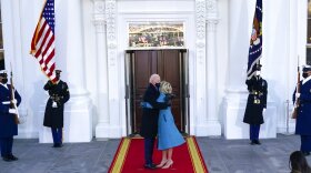 President Joe Biden and first lady Jill Biden hug as they arrive at the North Portico of the White House, Wednesday, Jan. 20, 2021, in Washington.