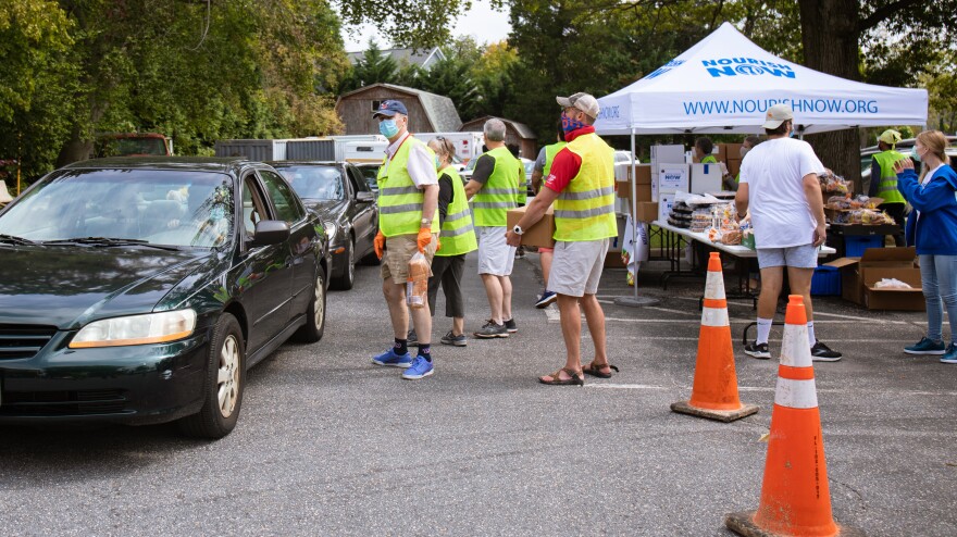 Drivers line up to receive food distribution in Bethesda. Food insecurity has increased in Montgomery County since the start of the pandemic.