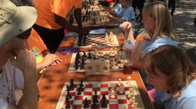 Participants in the first-ever Neighborhood Games compete in a chess tournament. The Games were first held in 2016 and take place every other year.