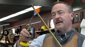 Pictured here is custom instrument maker George Schlub demonstrates the annealing process he uses in crafting his instruments.