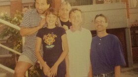 Leo del Aguila (from left), Vesa Gashi, Scott Simon, Erblin Mehmetaj and Shawn Fox in 1999 in a housing complex in Pristina. Del Aguila, Simon and Fox were covering the Kosovo conflict for NPR; the children lived in the war-stricken area.