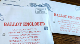 Two unopened Washington County ballots for Oregon's 2026 primary election sit on a table.