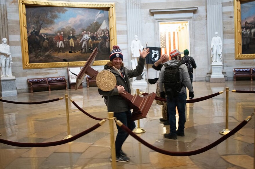 Man holding lectern in U.S. Capitol rotunda