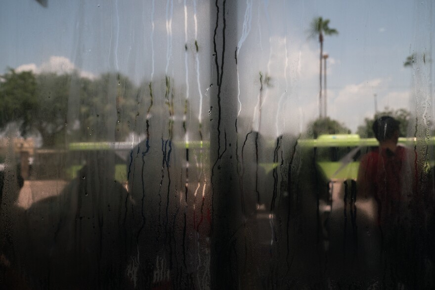 Outside the McAllen bus station, migrants prepare to board buses bound for American cities as they wait to learn whether they will be able to stay in the U.S. or will have to leave.