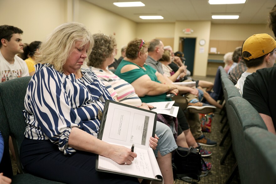 Candace Massurin, a sorority house director at Mizzou, takes notes during the Save-a-Life event on Wednesday, April 19, 2023, at Missouri United Methodist Church in Columbia. “You never know what’s going to happen. I don’t expect to ever need anything like this, but that’s all the more reason if I’m prepared and don’t expect it then I’ll be ready,” Massurin said. “The fact that there’s no charge and they’re going to give us Narcan is wonderful because then we have it available, and then we’re saving lives if it needs to happen. And I’ll know how. I have fear of the unknown, but now it will be known, so that part was important to me.” 