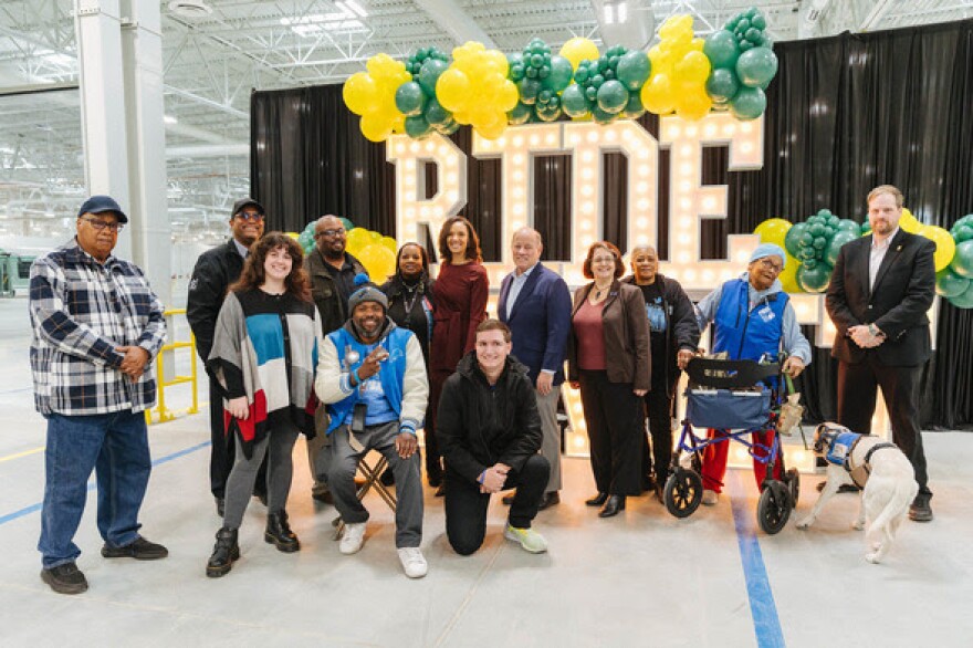 Detroit Mayor Mike Duggan and Mayor-elect Mary Sheffield pose with DDOT workers and transit advocates at the new Coolidge Terminal.