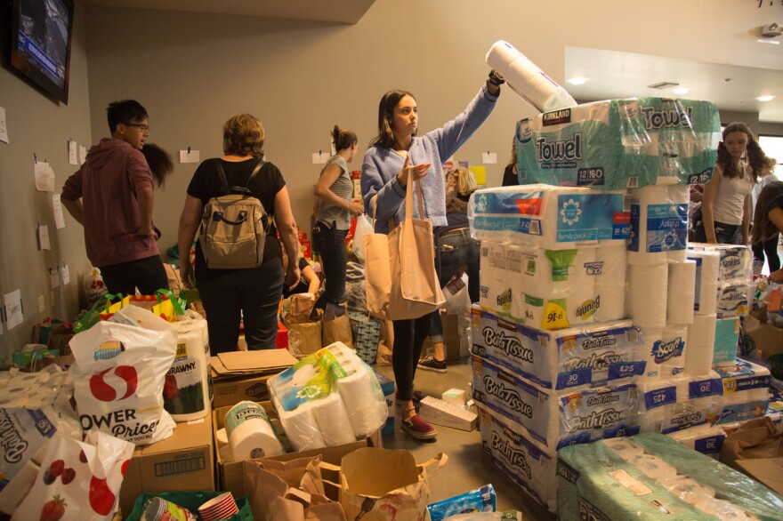 Volunteers at a collection center in Vallejo accept donations for victims of the wild fires in Sonoma and Napa Counties. (Photo by Clark Mishler)