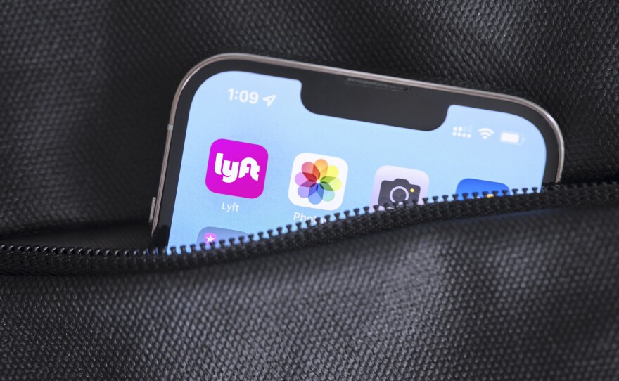 The Lyft app icon on a phone screen.