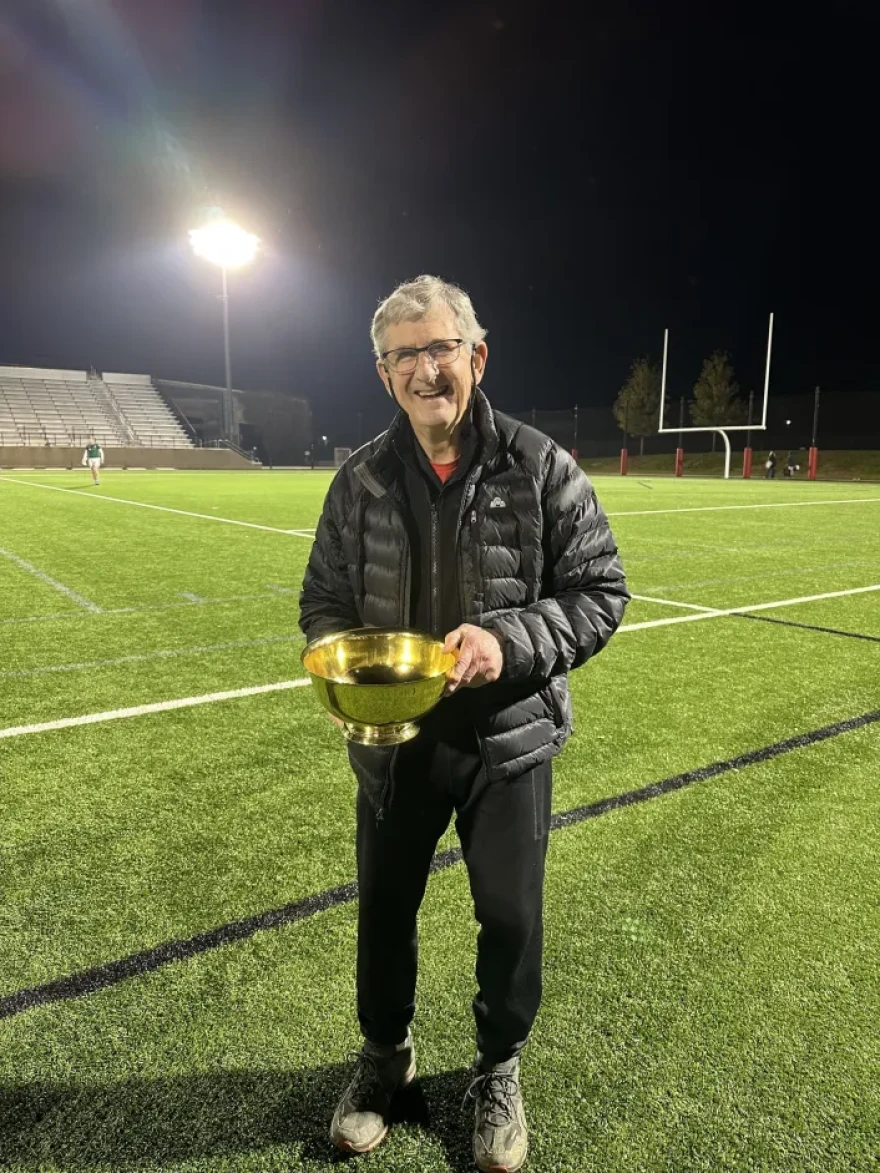 Jay Fluck holds the Liberty Conference Championship Bowl that Brown won on Nov. 4, 2023, at Fairfield University in Connecticut.