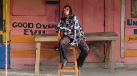 a woman posing for a photo on a chair 