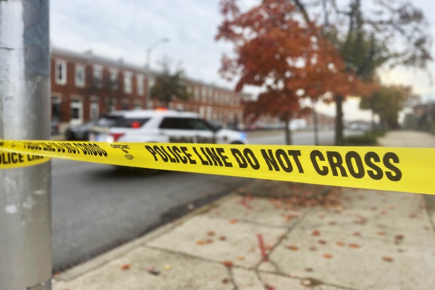 FILE - Crime scene tape sections off the scene of a shooting, Tuesday, Nov. 7, 2023, in southwest Baltimore, where police shot a man they said pointed a gun at officers. Maryland state prosecutors on Friday, Jan. 19, 2024, that four Baltimore police officers who fired three dozen shots at the armed man during a foot pursuit in November won’t face criminal charges. (AP Photo/Lea Skene, File)