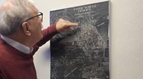 Covington Mayor Joe Meyer points to a map of Covington made before the Brent Spence Bridge and the IRS facility were built in the 1960s.