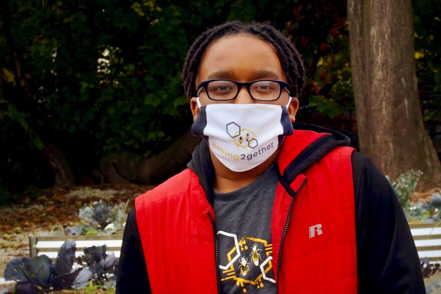 Keith Griffith III, 13, poses for a photo at the Farmers Market at Opportunity Community Garden in the Russell neighborhood on Oct. 24, 2020.