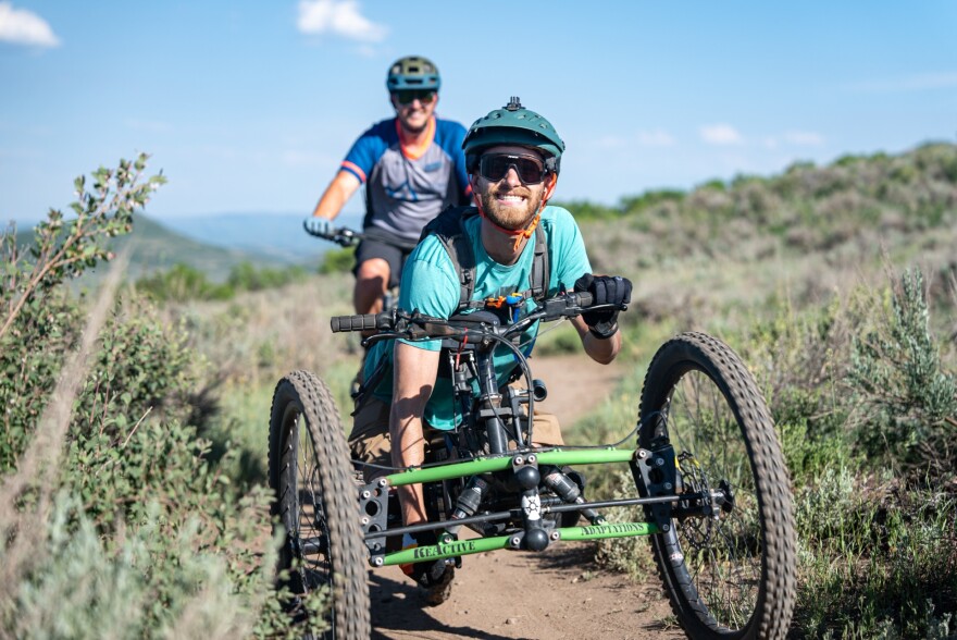 man in wheel chair on outdoor Utah trail 