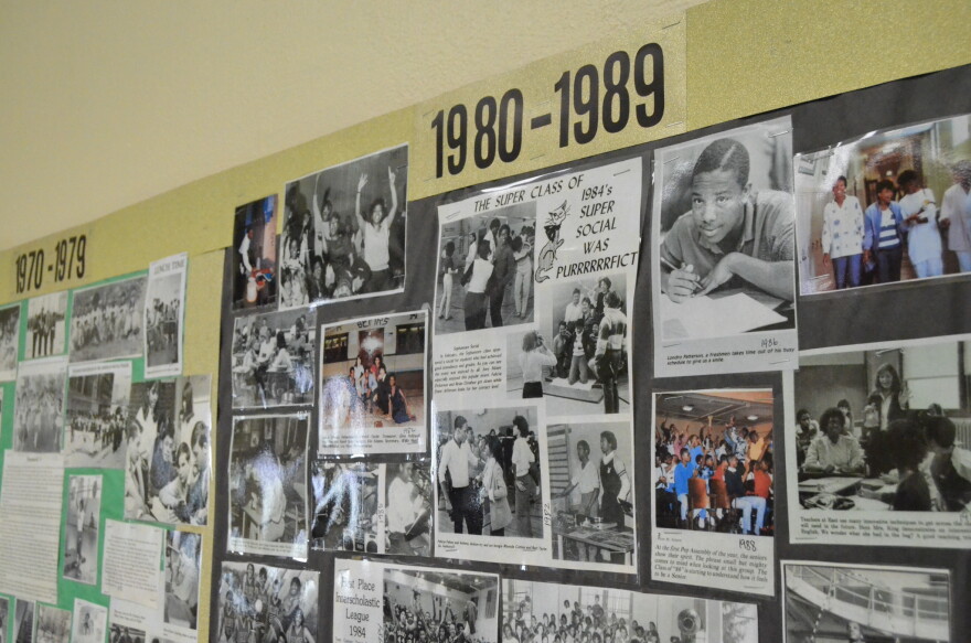 Alumni walked through East High School’s museum containing collages of photos, yearbooks and trophies spanning decades.