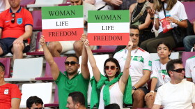 Iranian fans hold up signs advocating for women's rights prior to the FIFA World Cup Qatar 2022 Group B match between England and IR Iran at Khalifa International Stadium on Nov. 21, 2022 in Doha, Qatar. (Clive Brunskill/Getty Images)