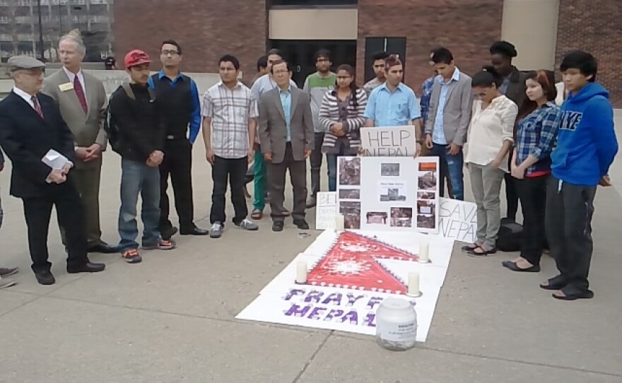 buffalo_state_college_students_and_faculty_gather_around_the_sight_of_a_candlelight_vigil_on_tuesday_afternoon_for_the_victims_of_nepal_s_devastating_earthquake_on_april_25th_0.jpg