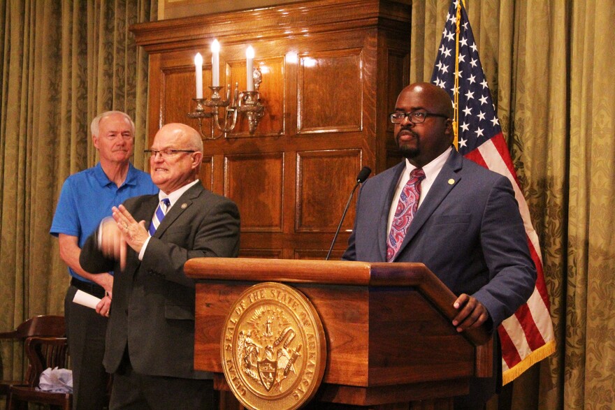 2022-04-05-Soloman_Graves-4484-edit-1500.jpg Gov. Asa Hutchinson looks on as Corrections Secretary Solomon Graves speaks to reporters at Tuesday's press conference.