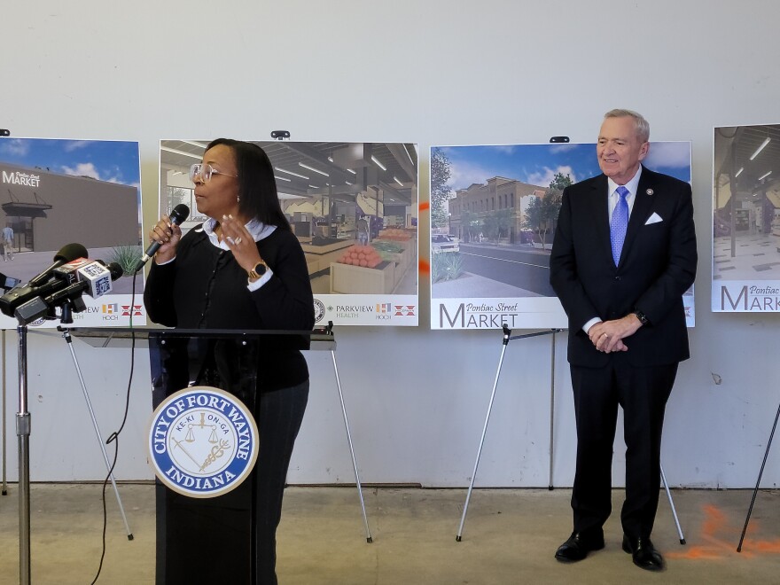 Sixth District Fort Wayne City Councilwoman Sharon Tucker speaks alongside Fort Wayne Mayor Tom Henry commemorating the start of the work on the Pontiac Street Market