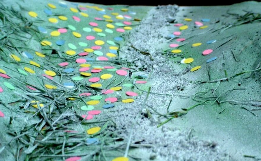 Close-up of the small pink, yellow, and green dots added to represent those who died during the Massacre. 