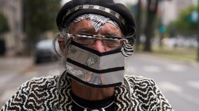 Clyde Casey is going out to get essential supplies. Casey is an artist and has started making woodcut signs that he is selling including one that say's "Quarantine and Chill." New Orleans, Louisiana. April 7, 2020.