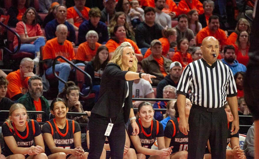 Girls high school basketball players inside an arena