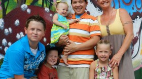 Senicka Arciaga-Spears (left), with his siblings and mothers, Kelly and Eliza. Senicka hopes to join the Boy Scouts if the Utah Pride Center's troop charter application is accepted.