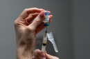 Lauren Ellenburg, a nurse, prepares a combination measles, mumps and rubella vaccine for a patient at Tiger Pediatrics in Easley, S.C., March 17, 2026.