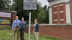 Meredith College professor Daniel Fountain (left), Leslie Cruickshank with the NC Highway Historical Marker Program (center) and UNCG University Archivist Erin Lawrimore (right) pose with the new historical marker for Virginia Tucker. 