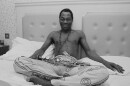 Nigerian multi-instrumentalist, musician, composer, and pioneer of the Afrobeat music genre Fela Kuti (1938 - 1997) in an hotel room, UK, 6th January 1984. (Photo by Mike Moore/Daily Express/Hulton Archive/Getty Images)