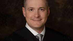 Madison County Associate Judge Andrew Carruthers found his name in the recently released U.S. Department of Justice files regarding Jeffrey Epstein, a sex offender accused of trafficking minors. Carruthers was assigned Epstein’s case in a collection matter in Lake County, Illinois, but said he never met him or communicated with him.