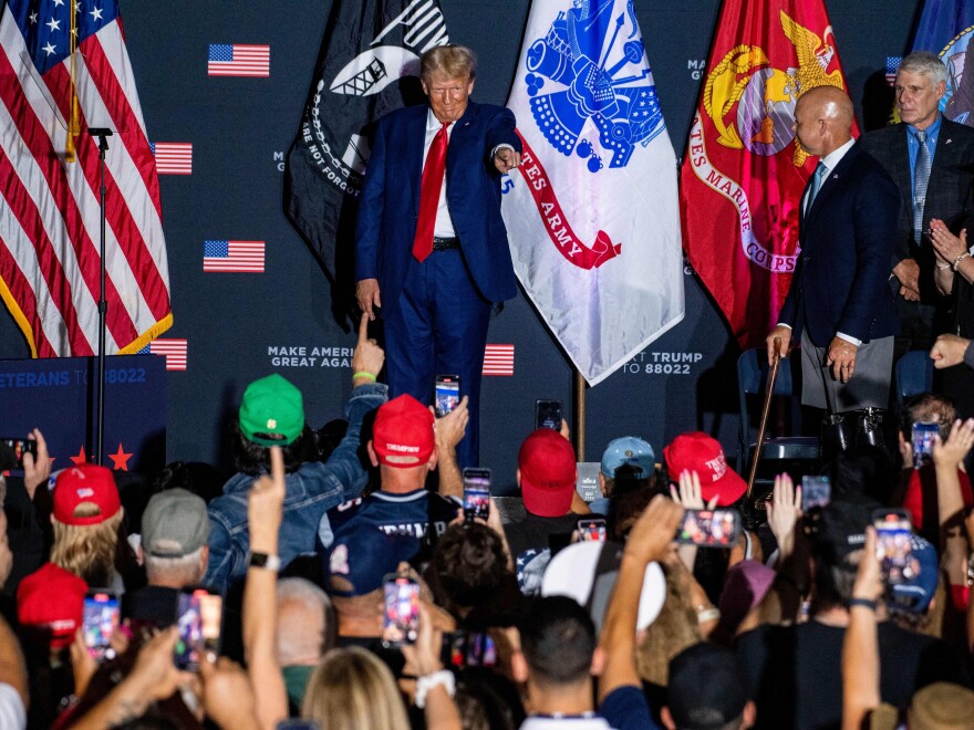 Former President Donald Trump arrives to speak during a campaign rally at Windham High School in Windham, N.H., on August 8.