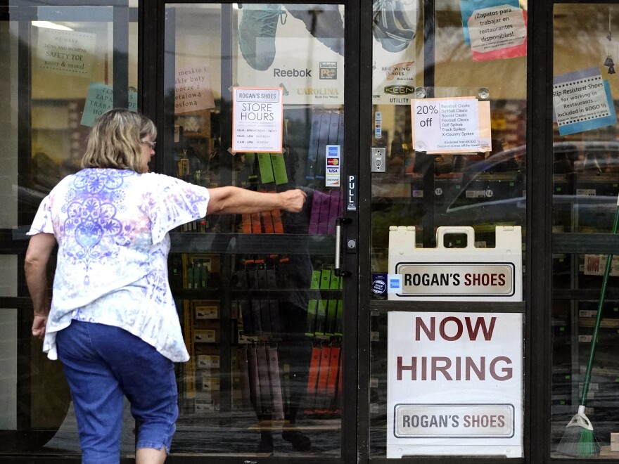 A hiring sign is displayed outside a store in Buffalo Grove, Ill. on June 24, 2021.