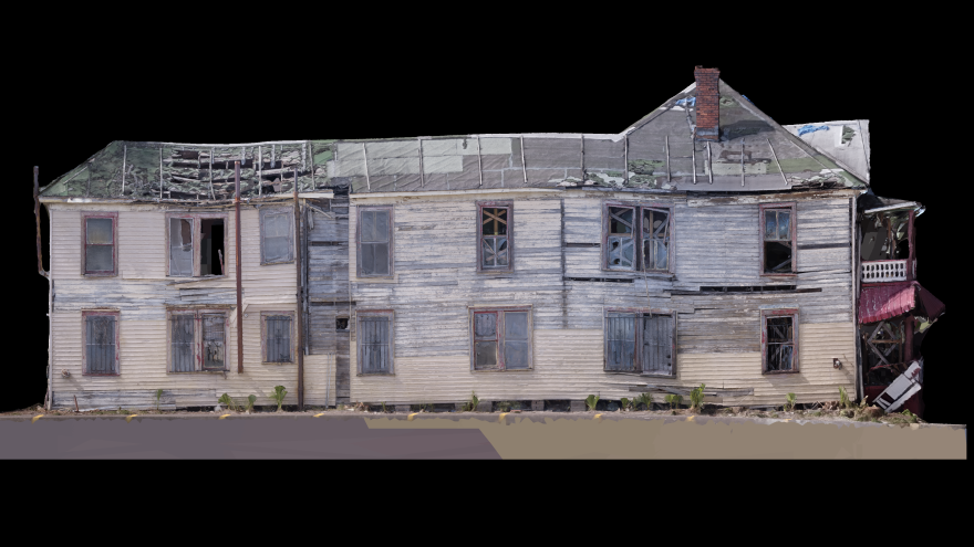 A 3D rendering of an old wooden building. Wooden panels sag, there are missing windows, and the roof and front balcony and entrance way show heavy damage, including huge holes in the roof near the back.