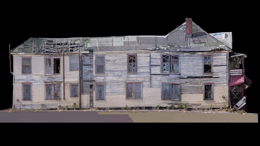 A 3D rendering of an old wooden building. Wooden panels sag, there are missing windows, and the roof and front balcony and entrance way show heavy damage, including huge holes in the roof near the back. 