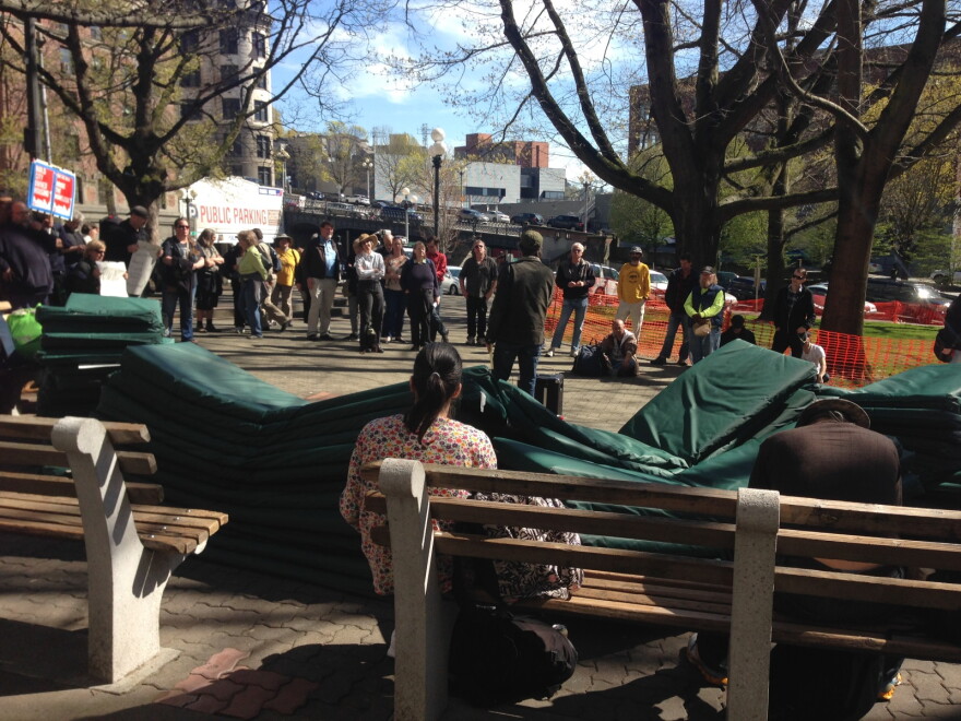 About 100 mattresses in the foreground as friends of SHARE prepare to camp outside the King County Administration Building.