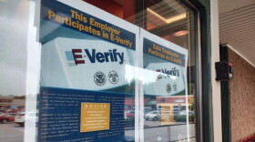 Employers enrolled in E-Verify are required to post information about the tool in an obvious place. These posters are displayed at the front entrance to the Keene Hannaford location. (Keene Sentinel photo)