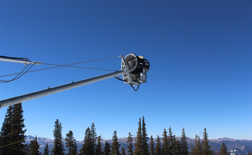 Elevated snowmaking guns allow man-made snow to fall on the mountain more naturally, providing a base for snowcats to groom.