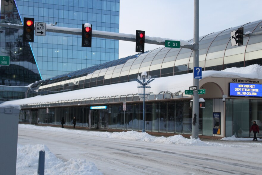several red lights at a snowy intersection