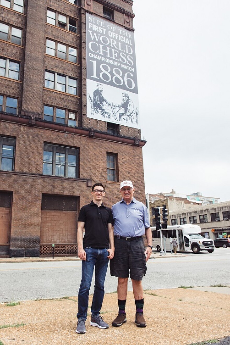 Grandmaster Fabiano Caruana (left) poses near the site of the first World Chess Championship, held in St. Louis in 1886.