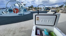 A cooler of popsicles sits by the play structure at Birch Bark Playground in Rifle during a meet-and-greet event with Every Child Parachute to Aspen executive director Samantha Markovitz on Aug. 18, 2026.