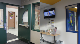 Right: Fire Lake Elementary School's entrance does not require visitors to go through the office. Left: Eagle River Elementary has a secure vestibule, where visitors must sign in at the front office before going into the rest of the school. (Katie Anastas/Alaska Public Media)