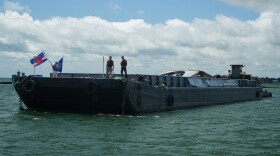A barge bringing Ralph Wilson Park Bridge to Ralph Wilson Park Conservancy.