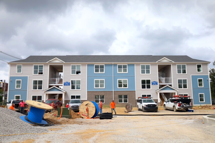 Workers putting the finishing touches on the Portshaw Apartments on West Main Street. The complex is expected to open by the end of 2025.