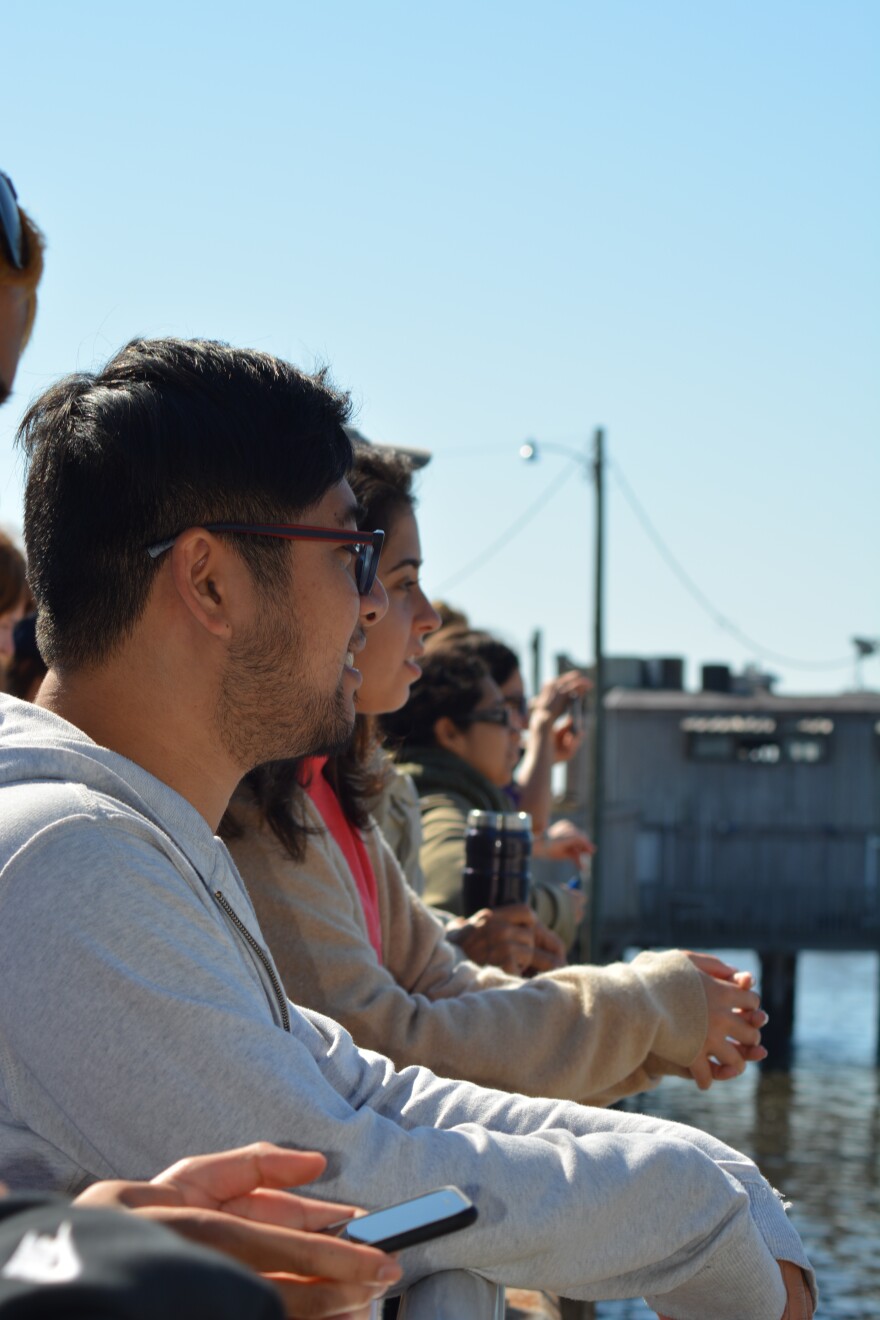 Onlookers watch the conclusion of the Workout on the Waterfront Repurpose-It Regalia on Saturday.