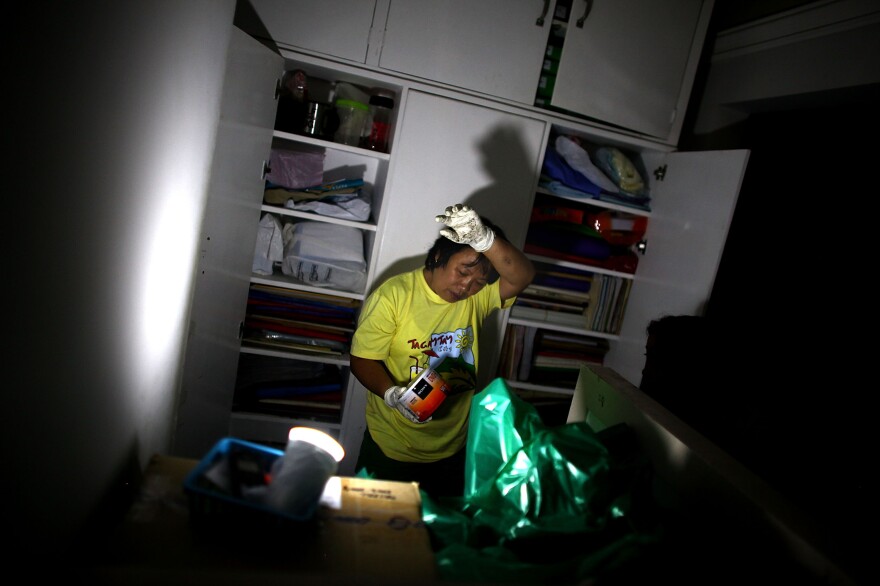 A nurse fights the heat and humidity in the lab of the Divine Word Hospital in Tacloban, Philippines, on Saturday.
