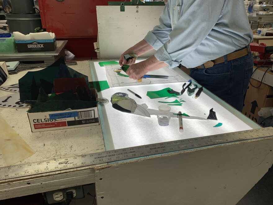 David Kittrell working on a stained glass piece at Kittrell Riffkind in Richardson.