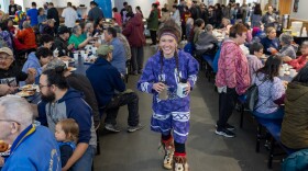 Miss Cama'i contestant (and future winner) Joeli Angukarnaq Carlson serves food at the 2025 Cama'i Dance Festival Native Foods Dinner.