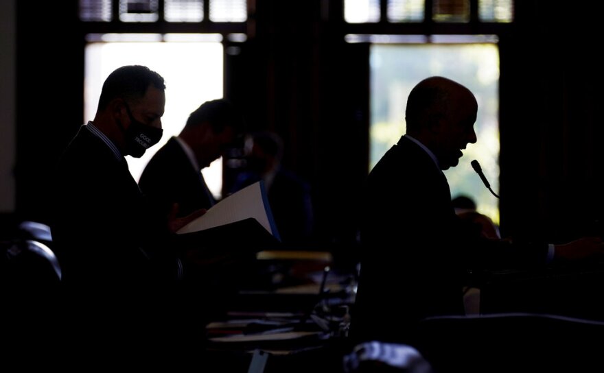 Rep. Chris Turner, D-Arlington, right, and Rep. Rafael Anchia, D-Dallas, left, line up to speak against HB 6, an election bill, in the House Chamber at the Texas Capitol in Austin, Texas, Thursday, May 6, 2021. 