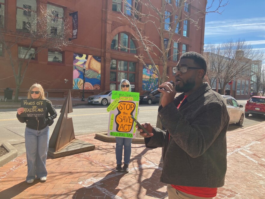 King Moosa of Citizen Action Illinois speaks at one of six rallies held Monday (across Illinois and Iowa) on the 16th anniversary of the Affordable Care Act, March 23, 2026.